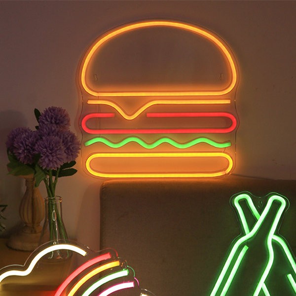 membawa tanda neon bercahaya di dinding - hamburger